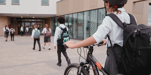 Learners going to school after summer.