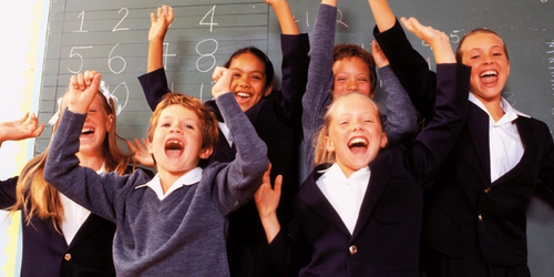 Learners cheering and being happy in class.