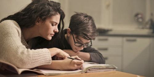 A parent and child working on literacy together