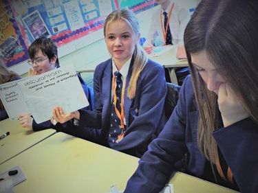 Learners at Ripley St Thomas holding up whiteboards with Tier 2 vocabulary