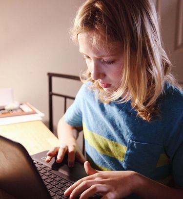 Learner working at a Chromebook