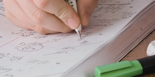 A student doing maths homework.