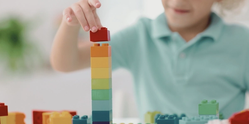 Child playing with building blocks.
