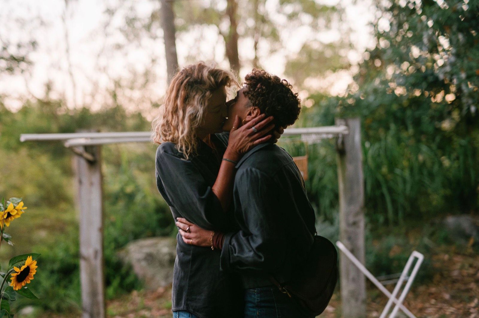 A couple embracing in a garden.