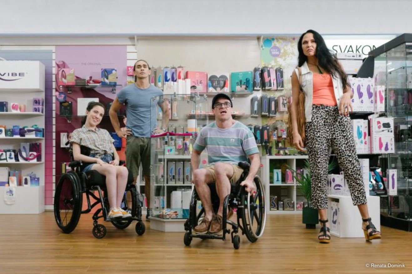 Four characters look up in an adult store.