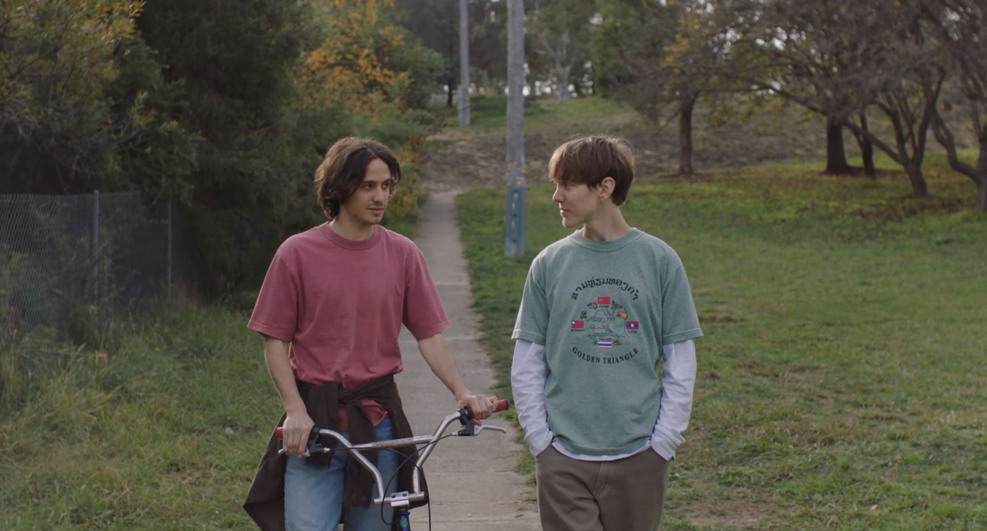 Two young men on a suburban street.