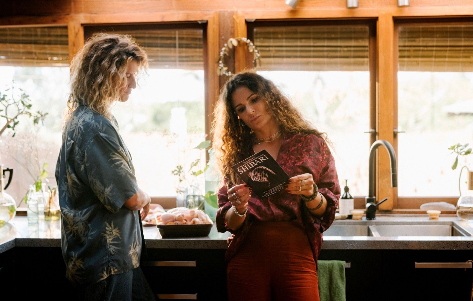 Two women in a kitchen.