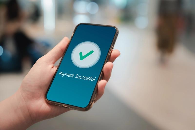 Paypal Business Mobile payment processing on cell phone that says "payment successful"