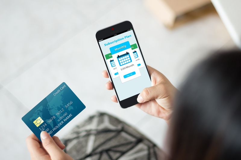 Customer using subscription payment processing gateway with credit card and phone