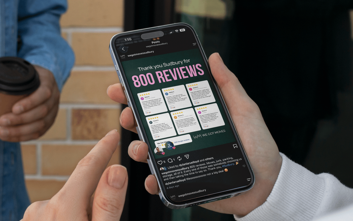 A phone showing a We Got Moves Instagram post celebrating 800 Google reviews, with a grid of five-star customer testimonials.