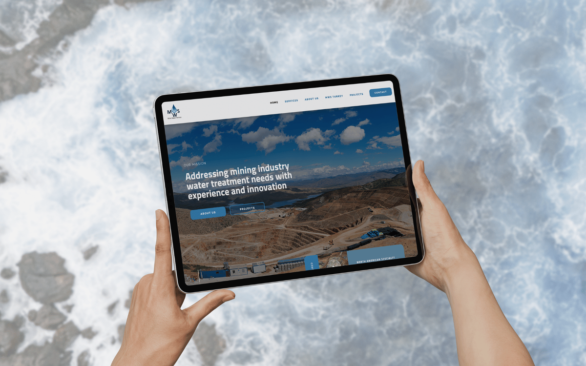 An iPad displaying the Mine Water Service website homepage, showing a mining site photo and the tagline "Addressing mining industry water treatment needs with experience and innovation."