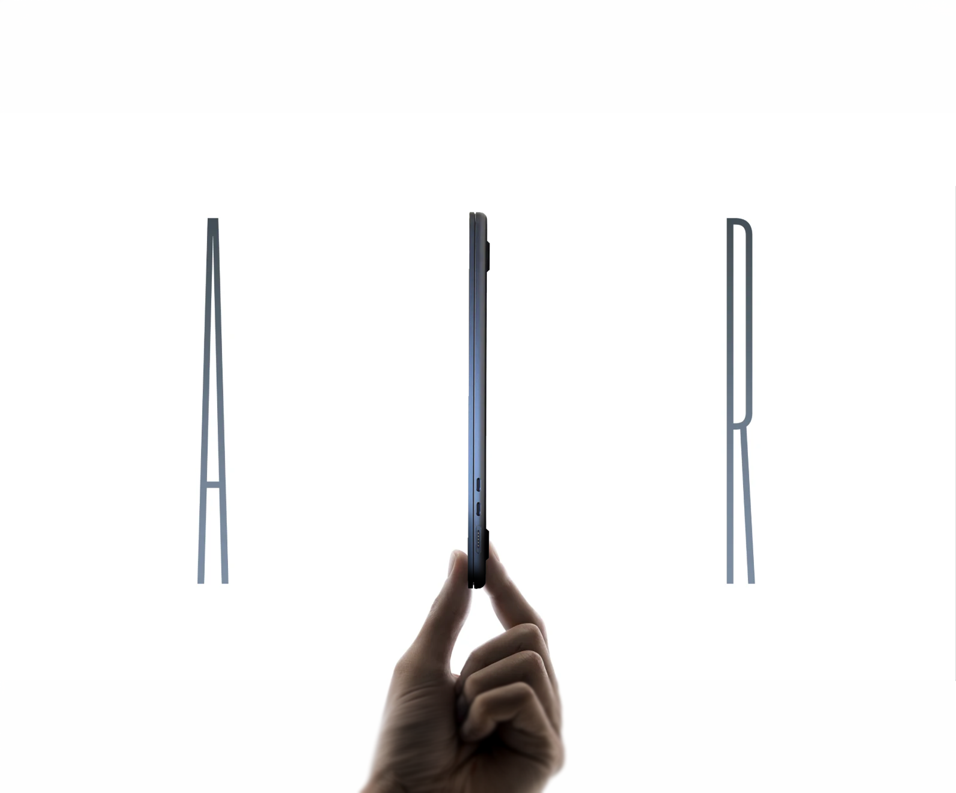 A hand pinching the MacBook Air from the side. The MacBook Air stands in place of the iPhone Air, photoshopped into its marketing image.