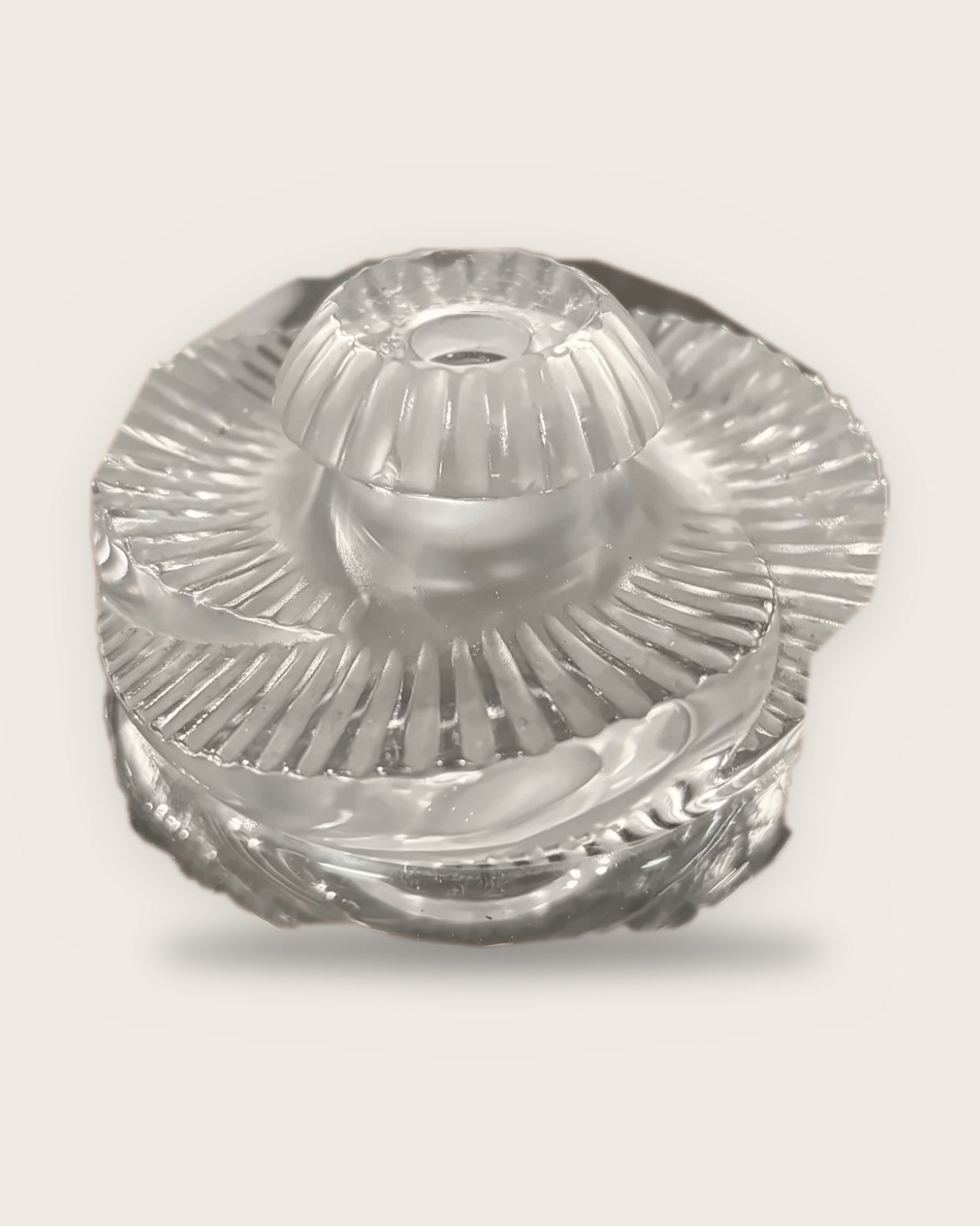 Lalique perfume bottle with a spiralling ray pattern