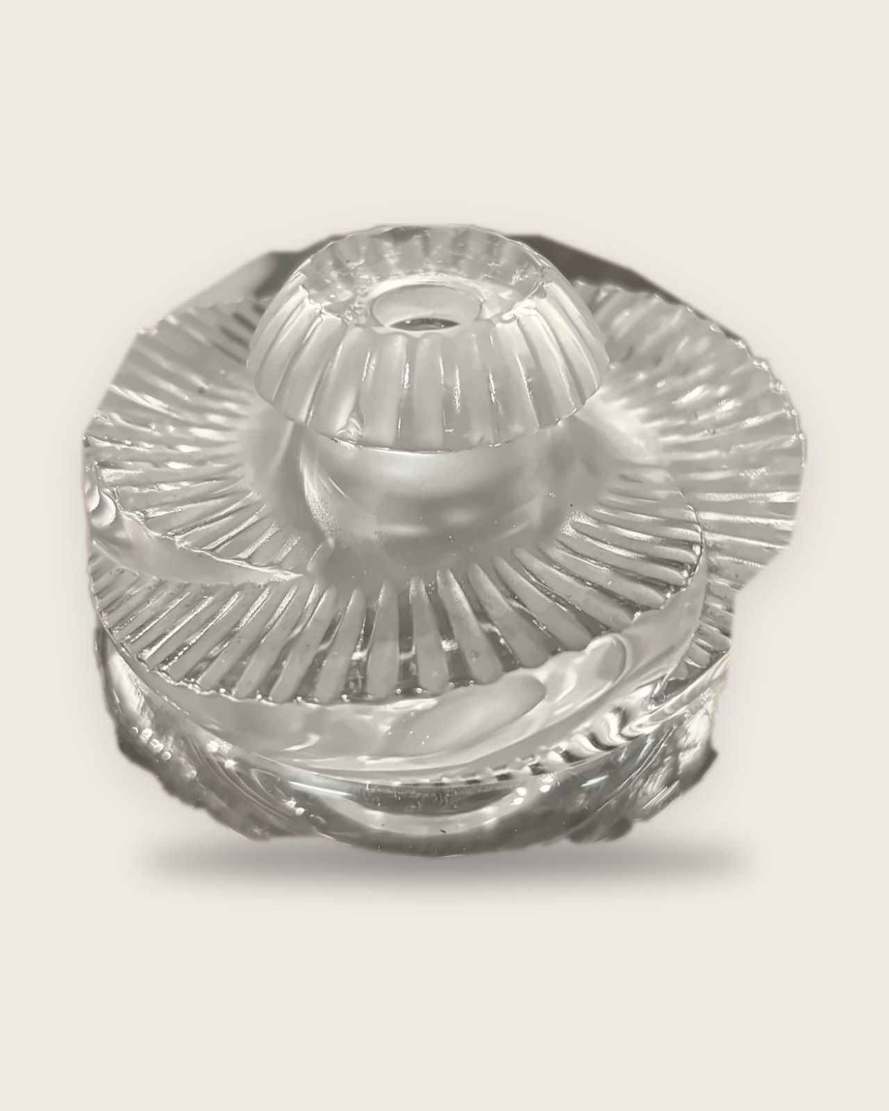 Lalique perfume bottle with a spiralling ray pattern