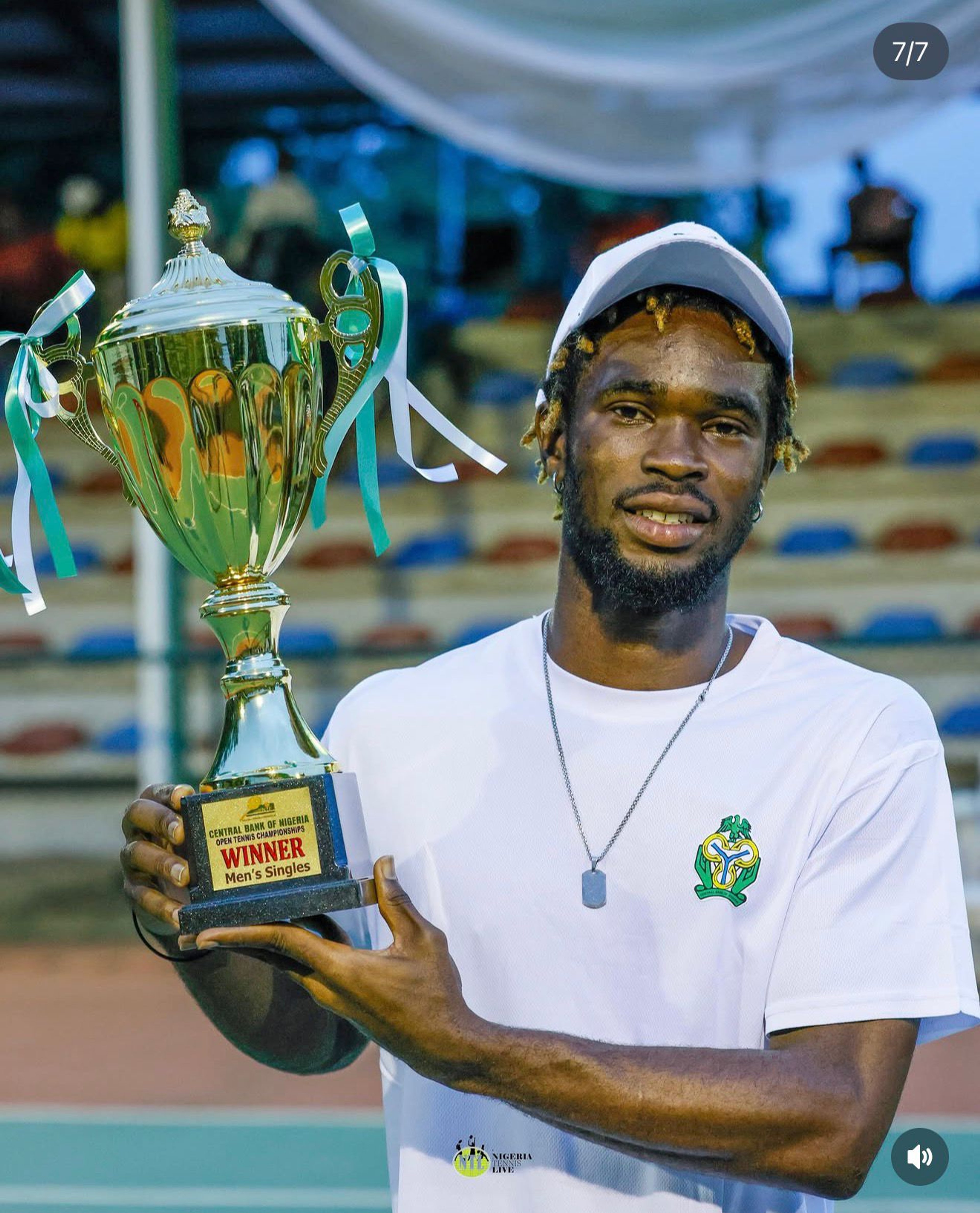 Canice lifts the CBN Open Tennis Championship men's singles trophy
