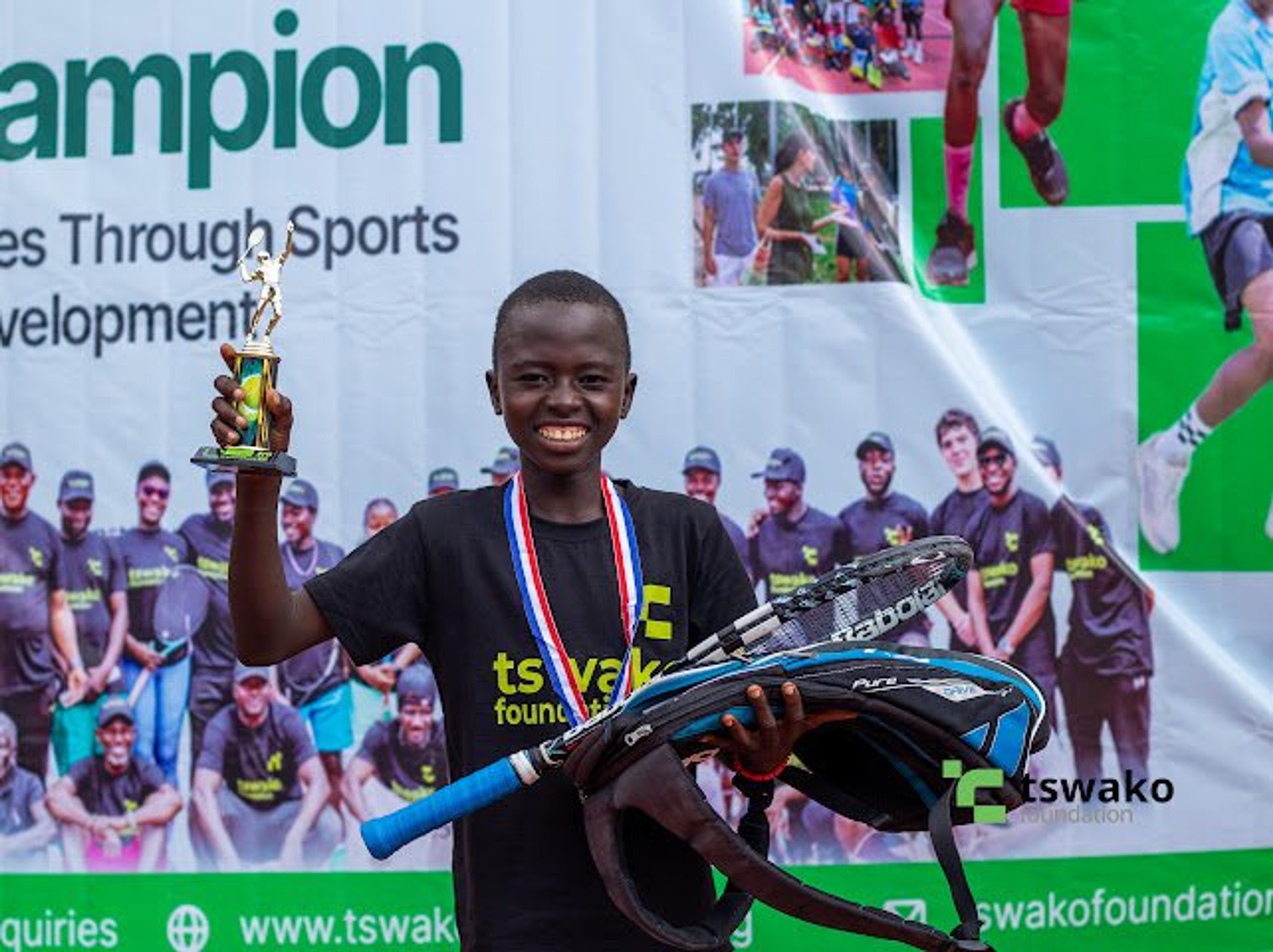 Player celebrating with her medal at the 9th edition tournament