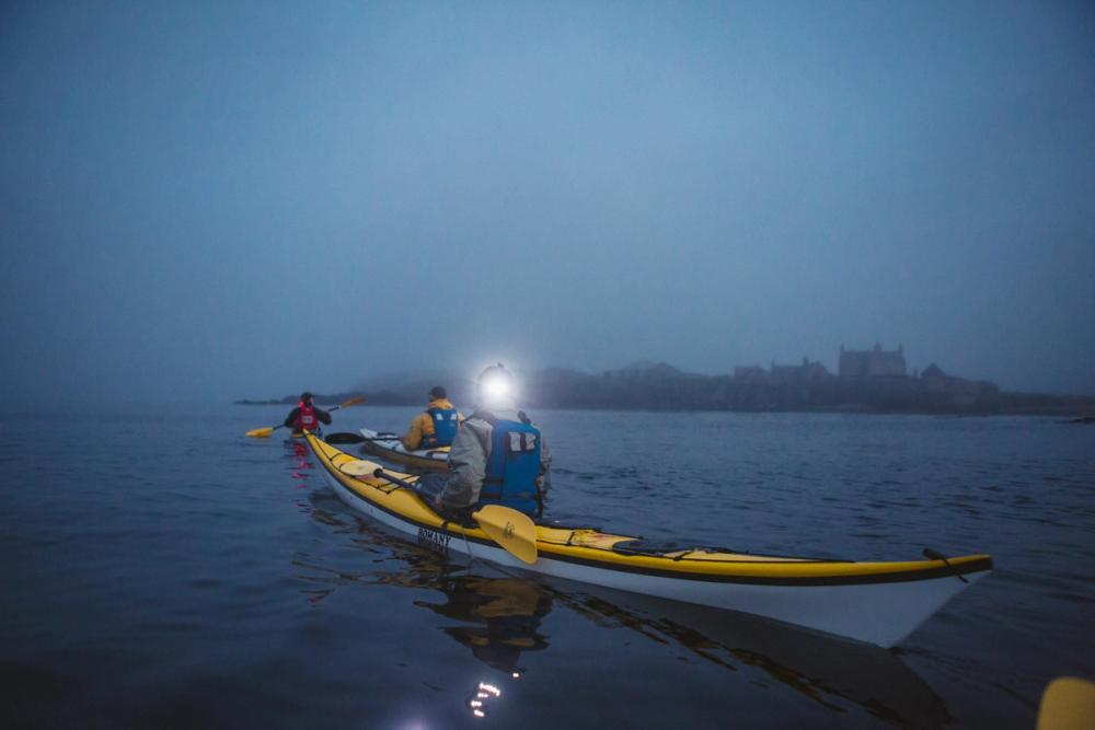 Kayakers on a misty night