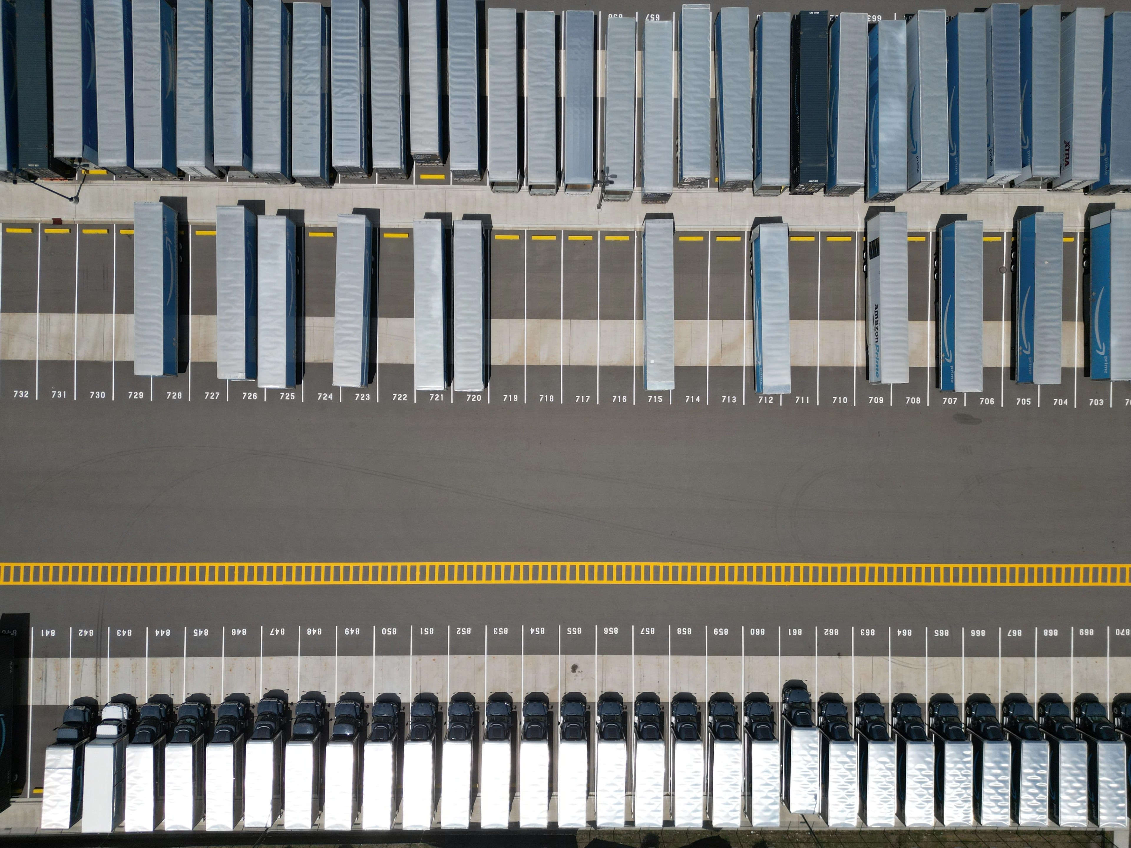 Aerial view of trucks parked in an industrial lot