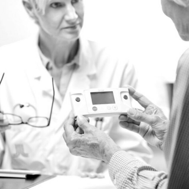 two personsons with digital artefact