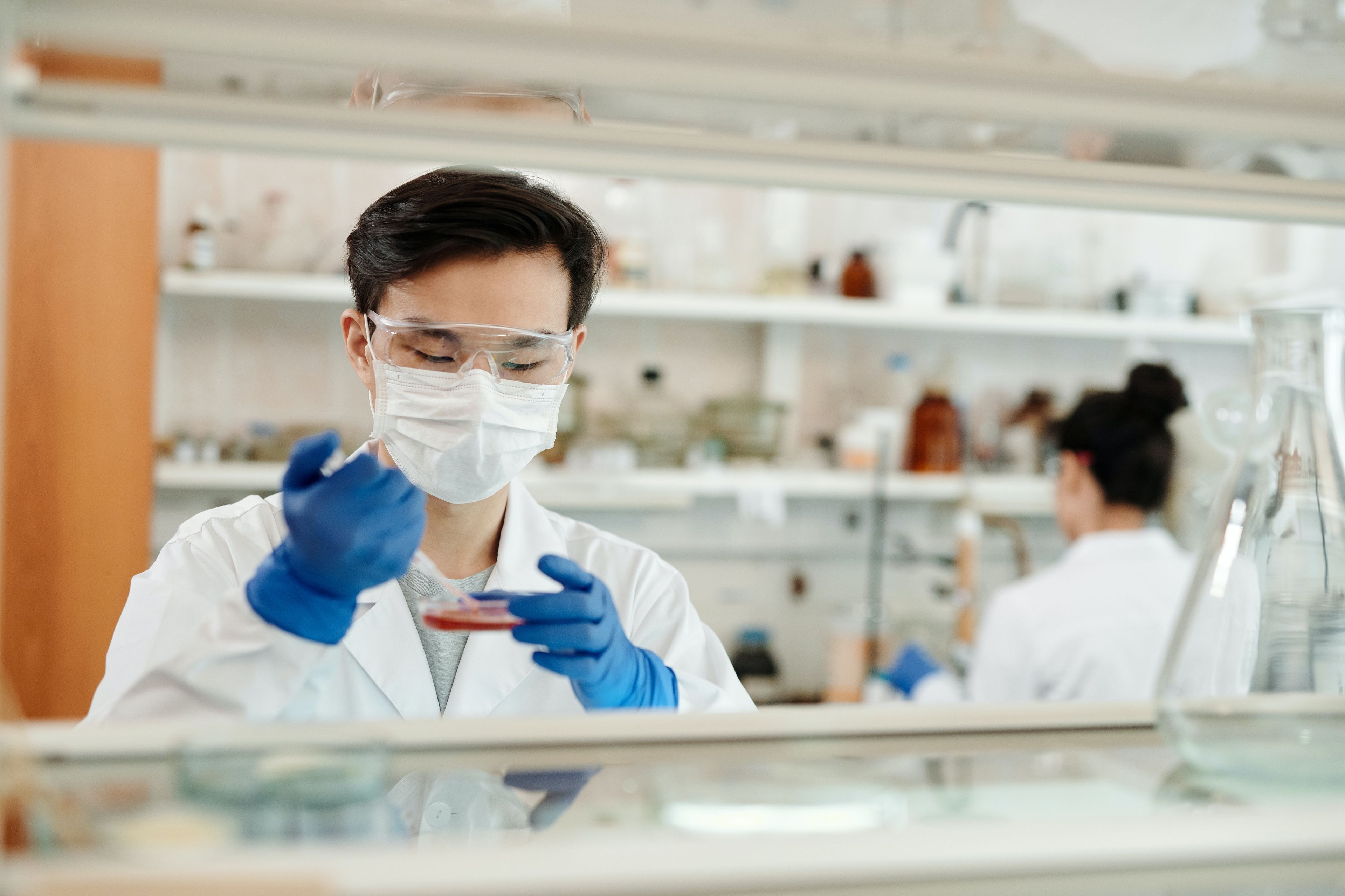 A man is running tests with a blood sample.