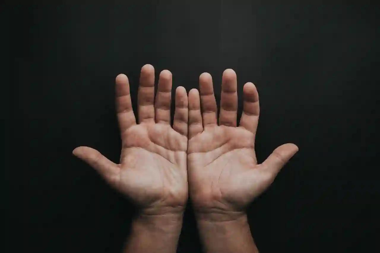 Two hands preparing for palm reading