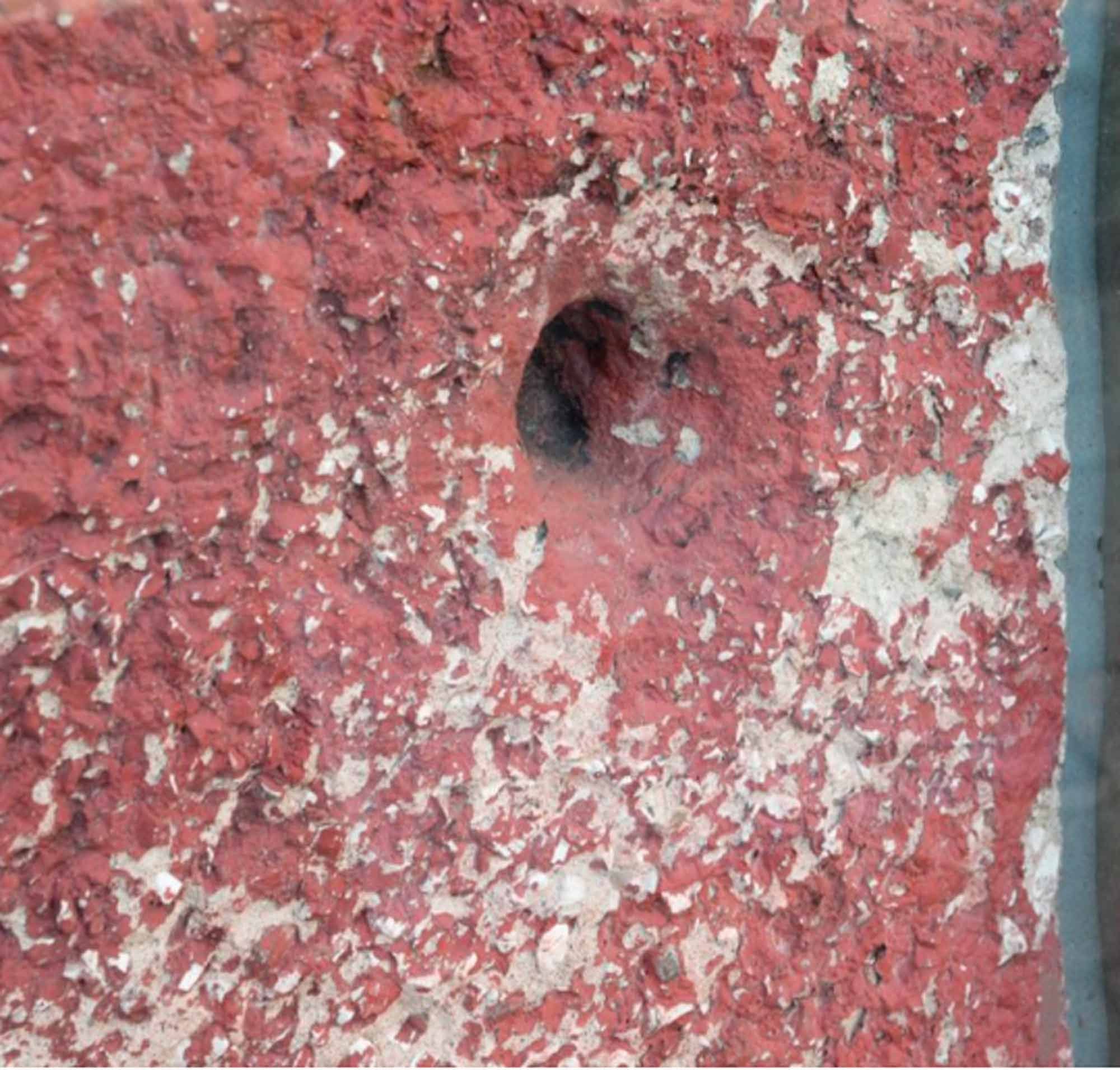 A bullet hole from Bloody Sunday preserved on the wall of the façade of the Museum of Free Derry. Photo: Paola Bernardelli.