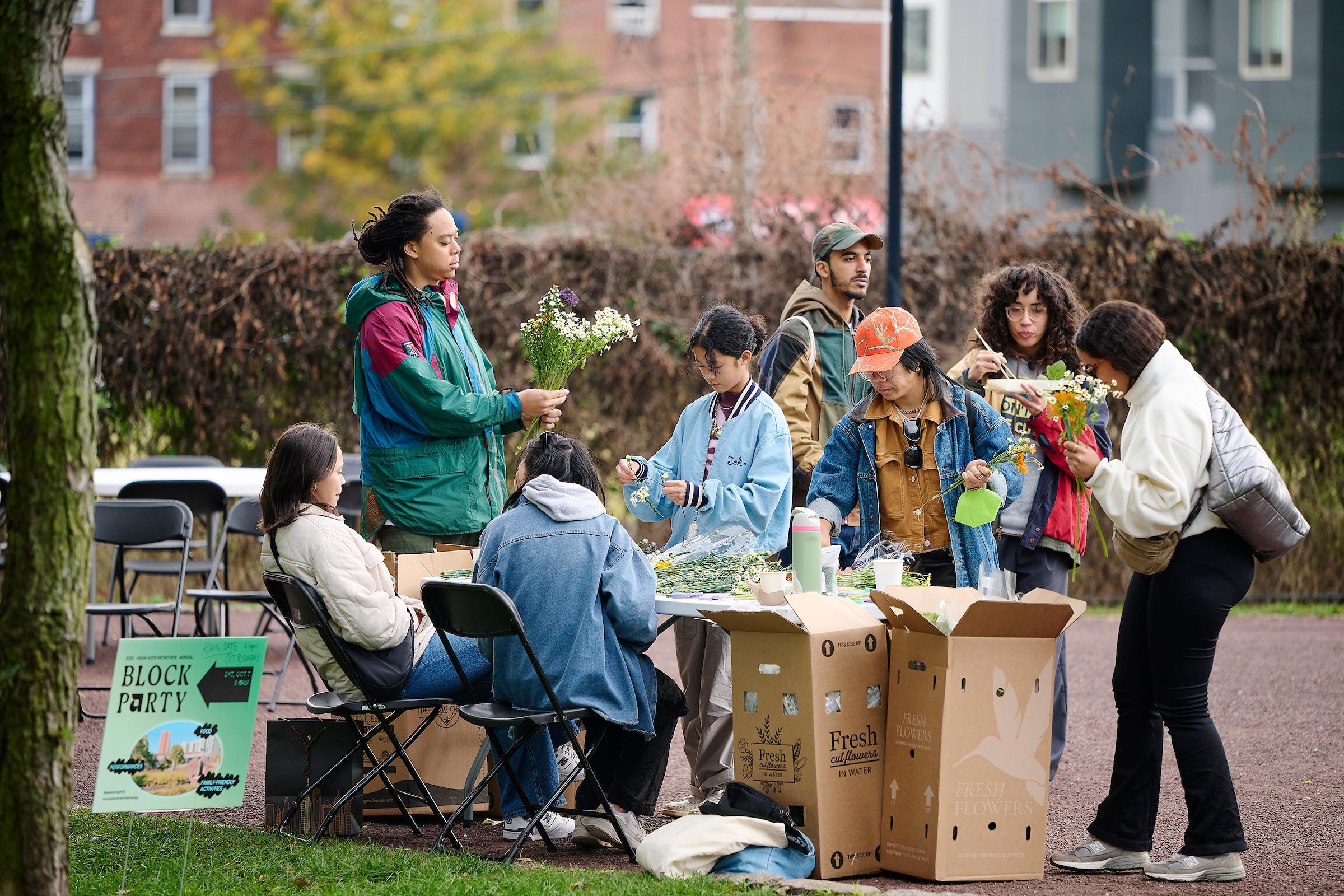 Photo courtesy of Albert Yee. People make flower crowns at the AAI Block party.