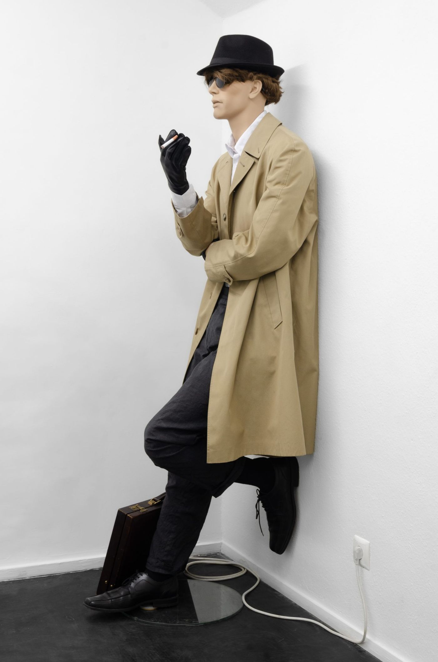 Connor Crawford, Hardboiled Crime Hater, 2024, Mannequin, micro-controller, speaker, LED, motor, electronics, clothing, briefcase, wig, sunglasses, single channel audio (6 minutes, 33 seconds), 180cm x 70cm x 58cm, Shore Gallery.