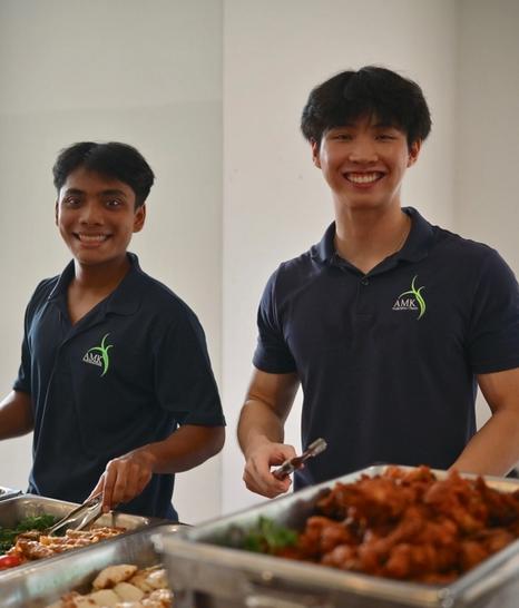 Youths on duty serving food
