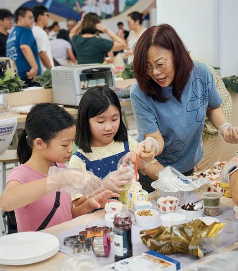 Children and adult preparing food