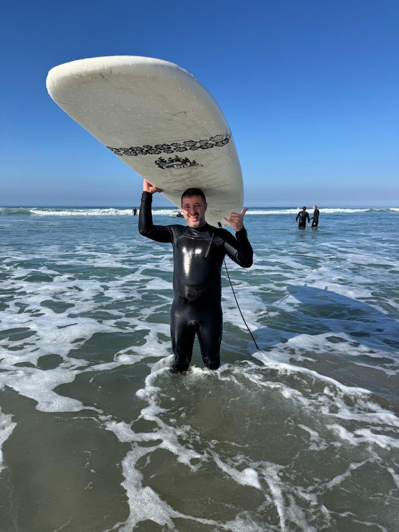 Jewmanity member surfing with board on their head