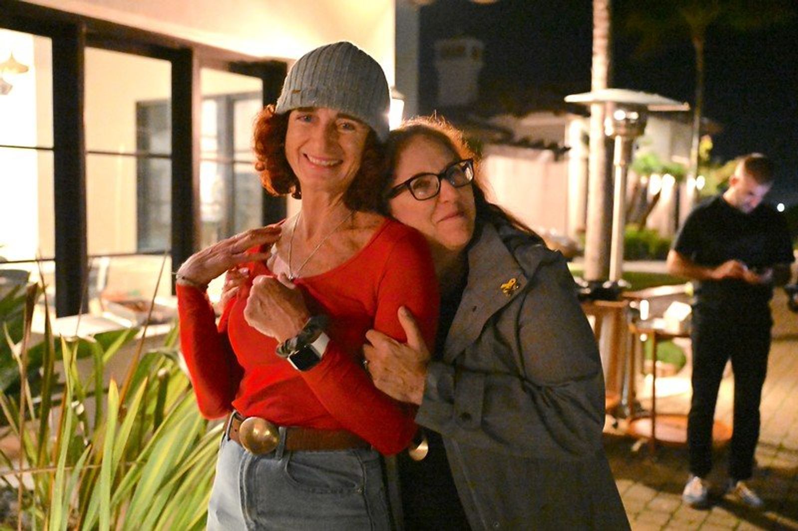 Hug between Jewmanity members outside