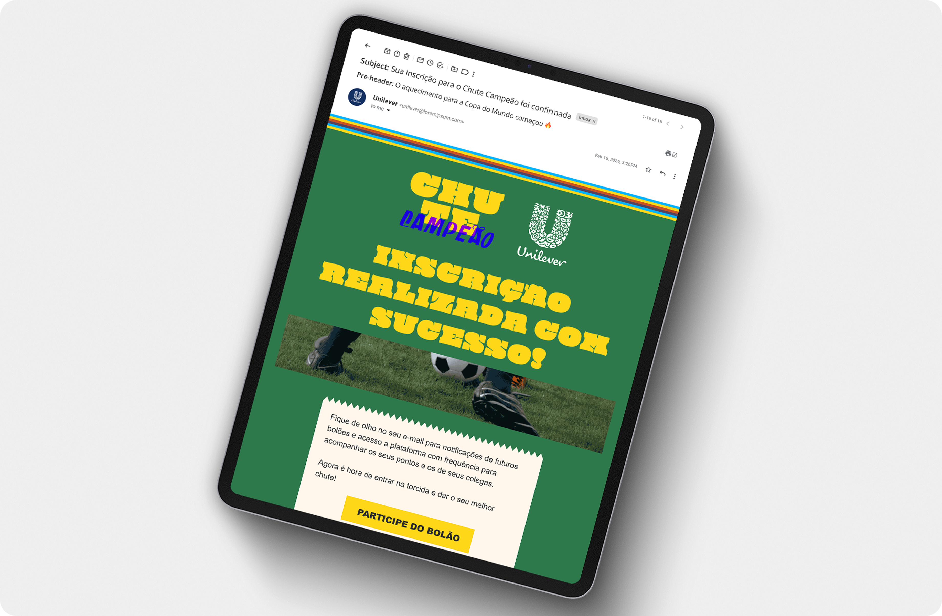 A tablet screen displays a confirmation email from Unilever for the "Chute Campeão" campaign. The email features yellow bold text reading "Inscrição Realizada Com Sucesso!" over a green background, accompanied by a soccer pitch photo and a yellow button labeled "PARTICIPE DO BOLÃO.