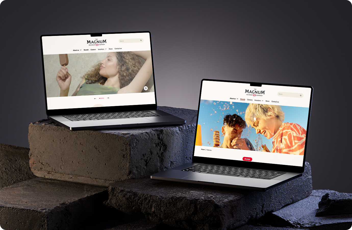 Two laptop screens showing the new Magnum website featured banners
