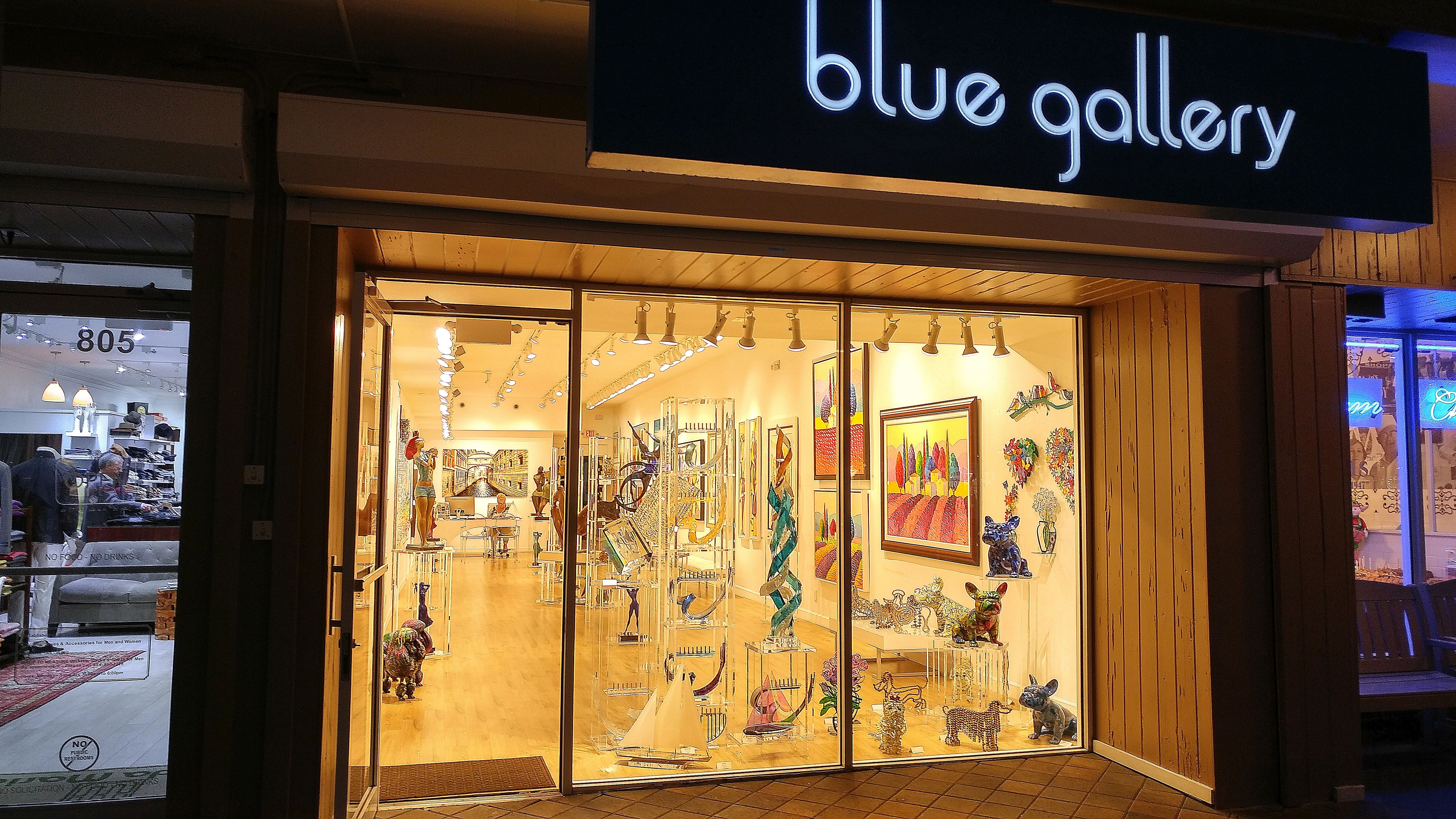 An art gallery storefront on Las Olas Boulevard at night in a 2017 photograph; not the Naia restaurant.