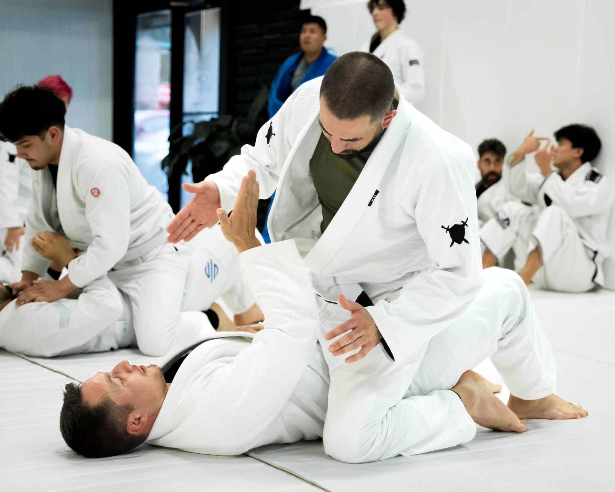 A coach breaking down a position while the room watches