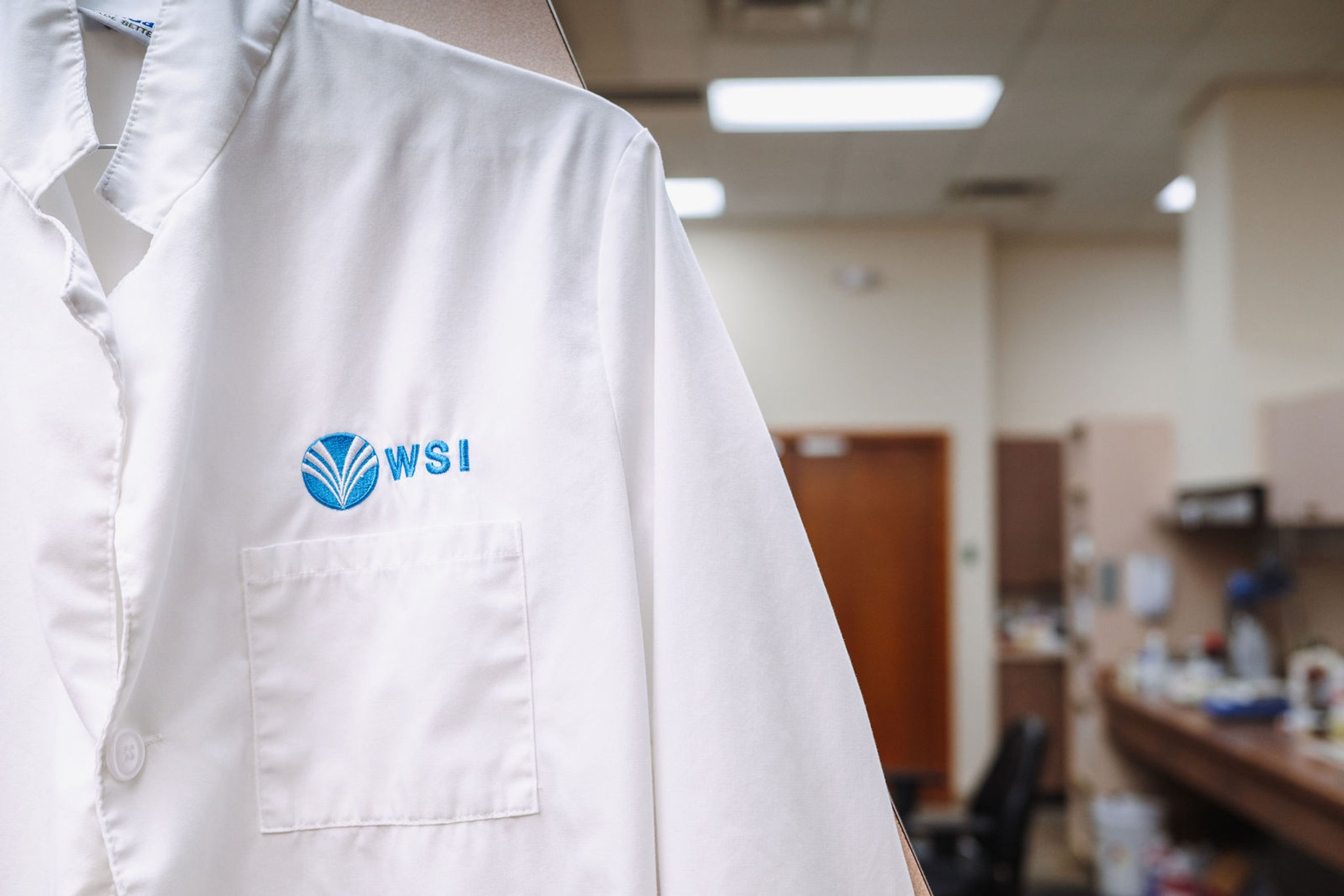 WSI branded lab coat in laboratory