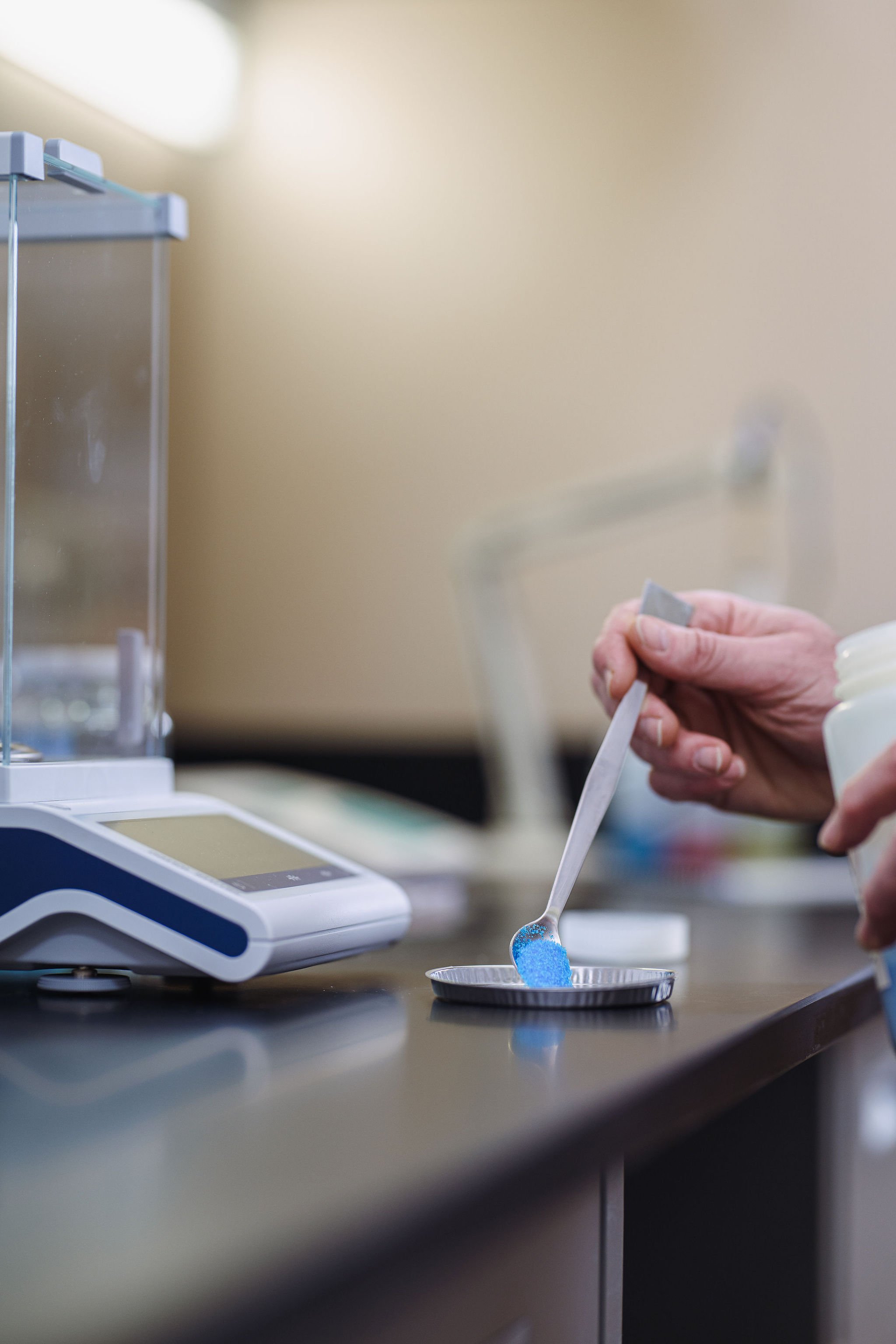 Blue powder on precision scale