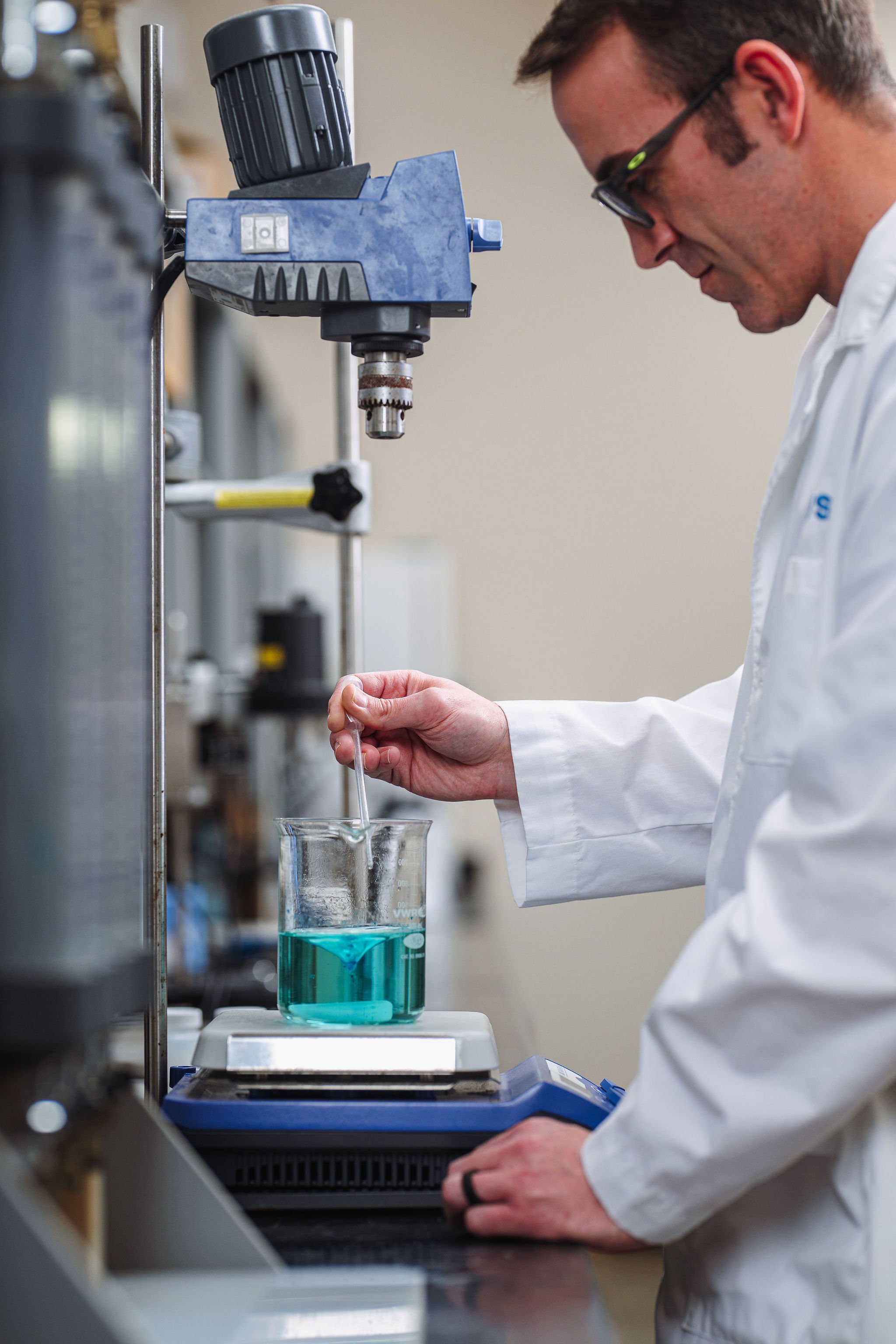 WSI chemist mixing water treatment solution