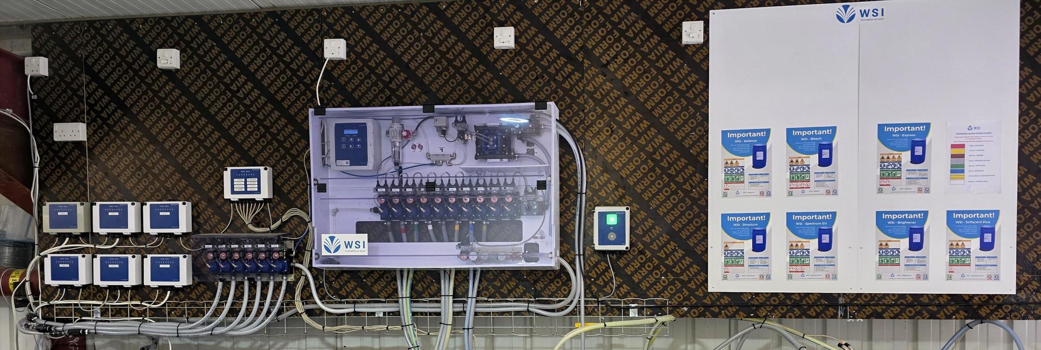 WSI dosing panel with online monitoring and labelled chemical safety board at Swift Choice