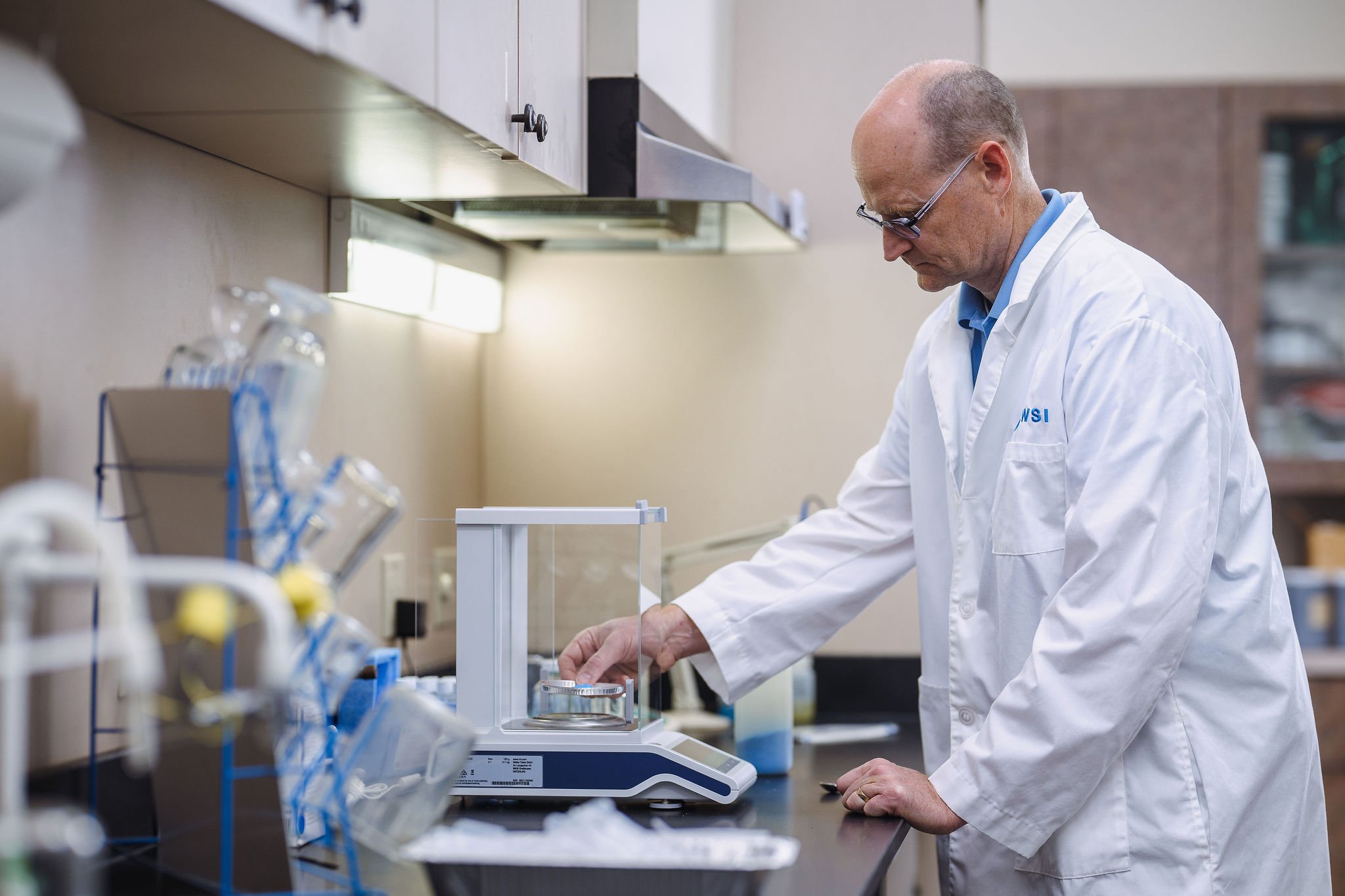 WSI scientist at analytical balance