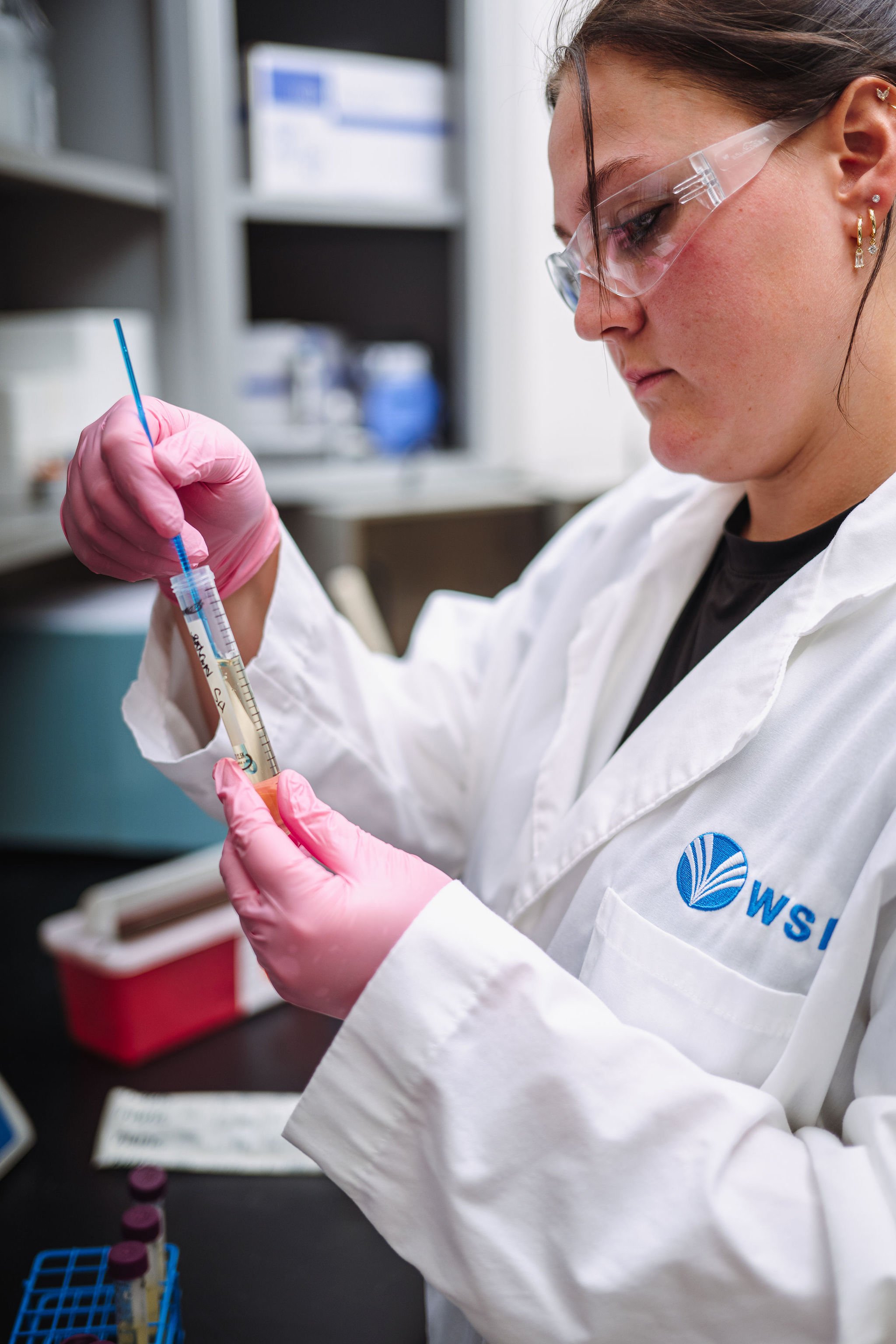 WSI scientist pipetting solution