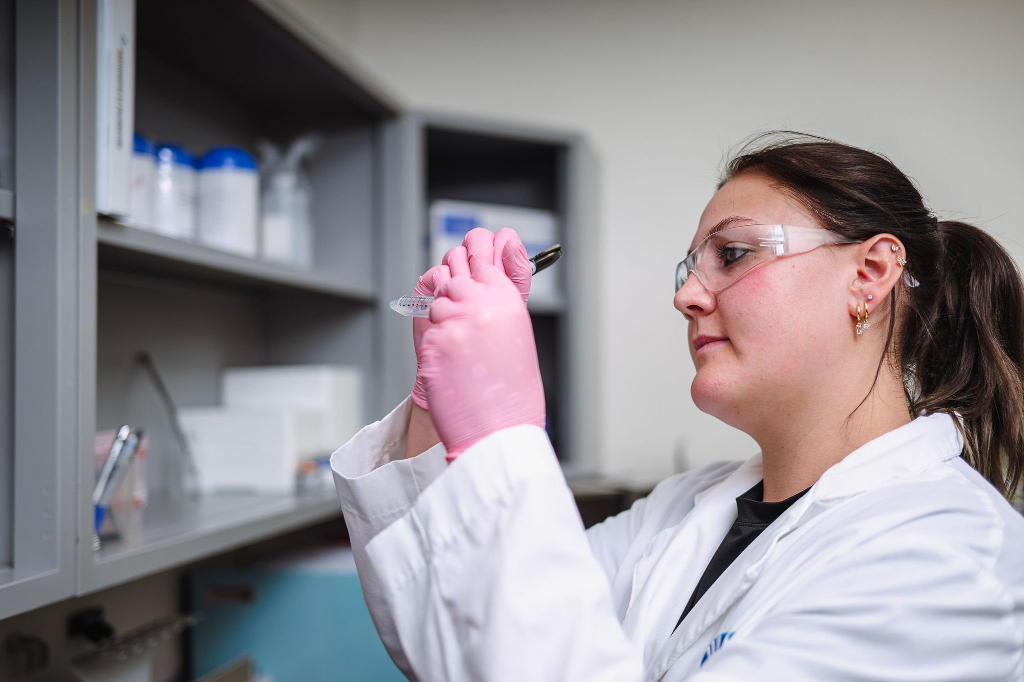WSI scientist examining sample