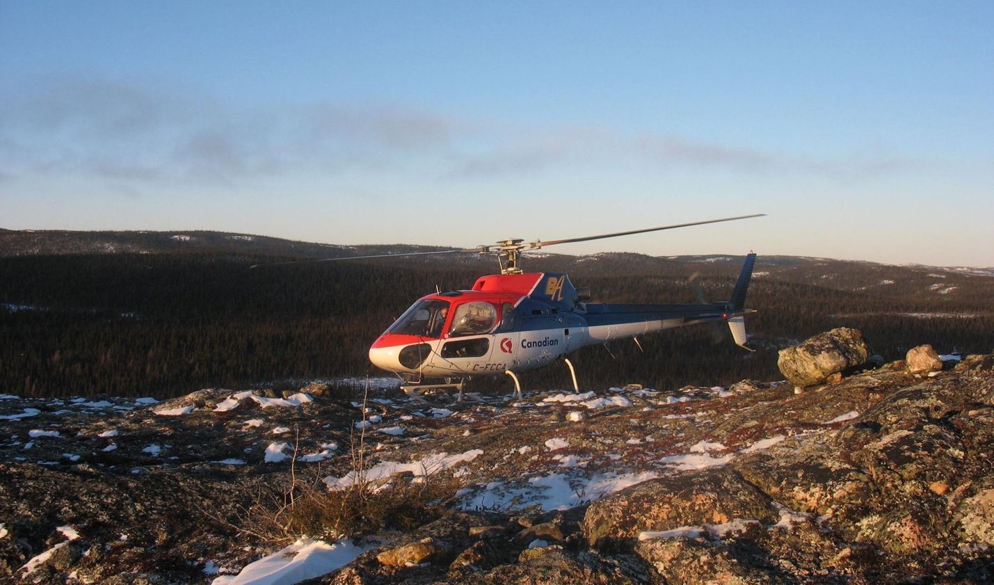 A helicopter on a rocky terrain AI-generated content may be incorrect.