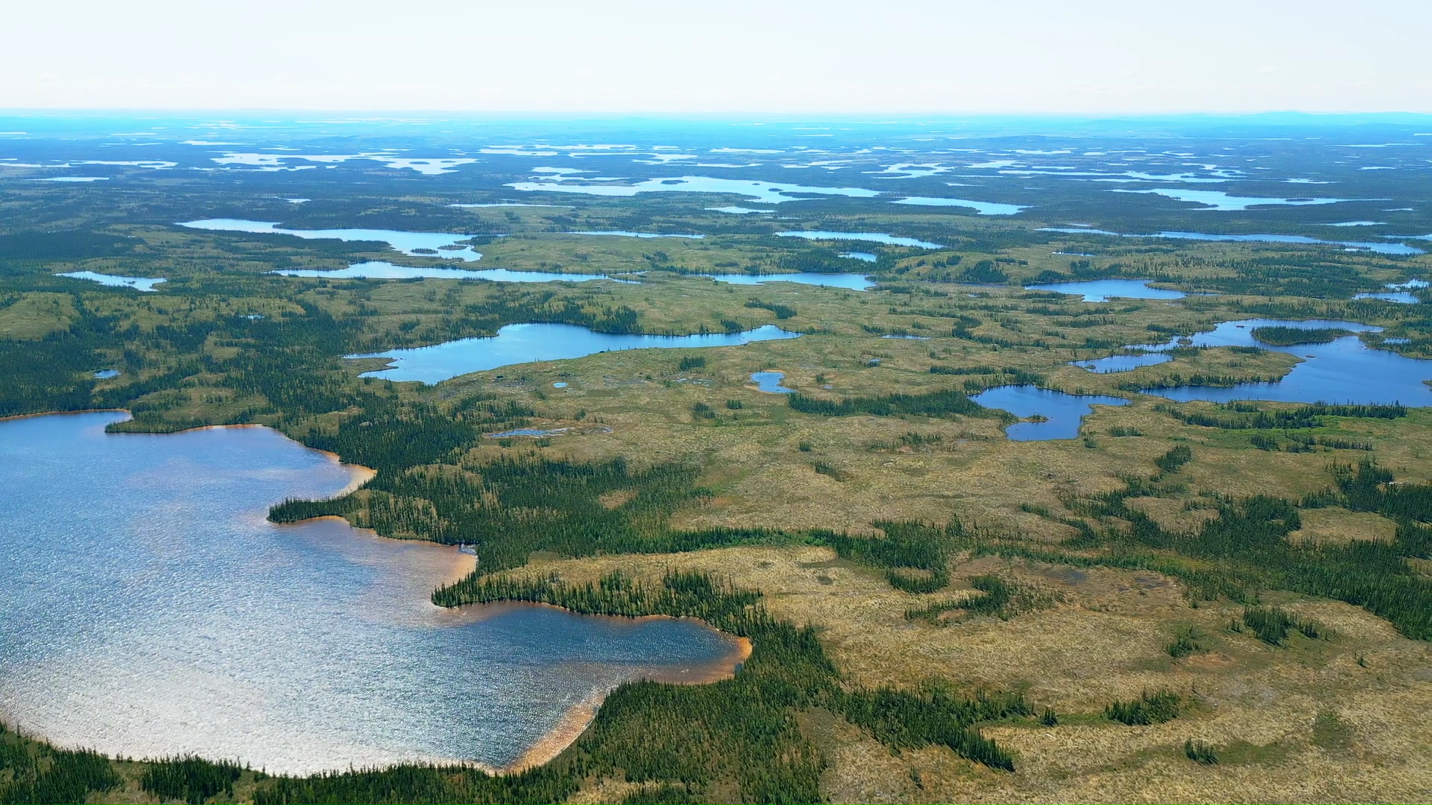 Aerial view of a lake AI-generated content may be incorrect.