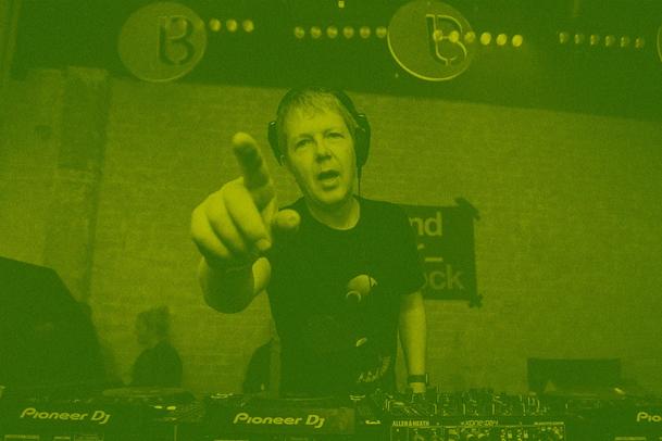 John Digweed point to the camera while behinds the decks at E1, London.