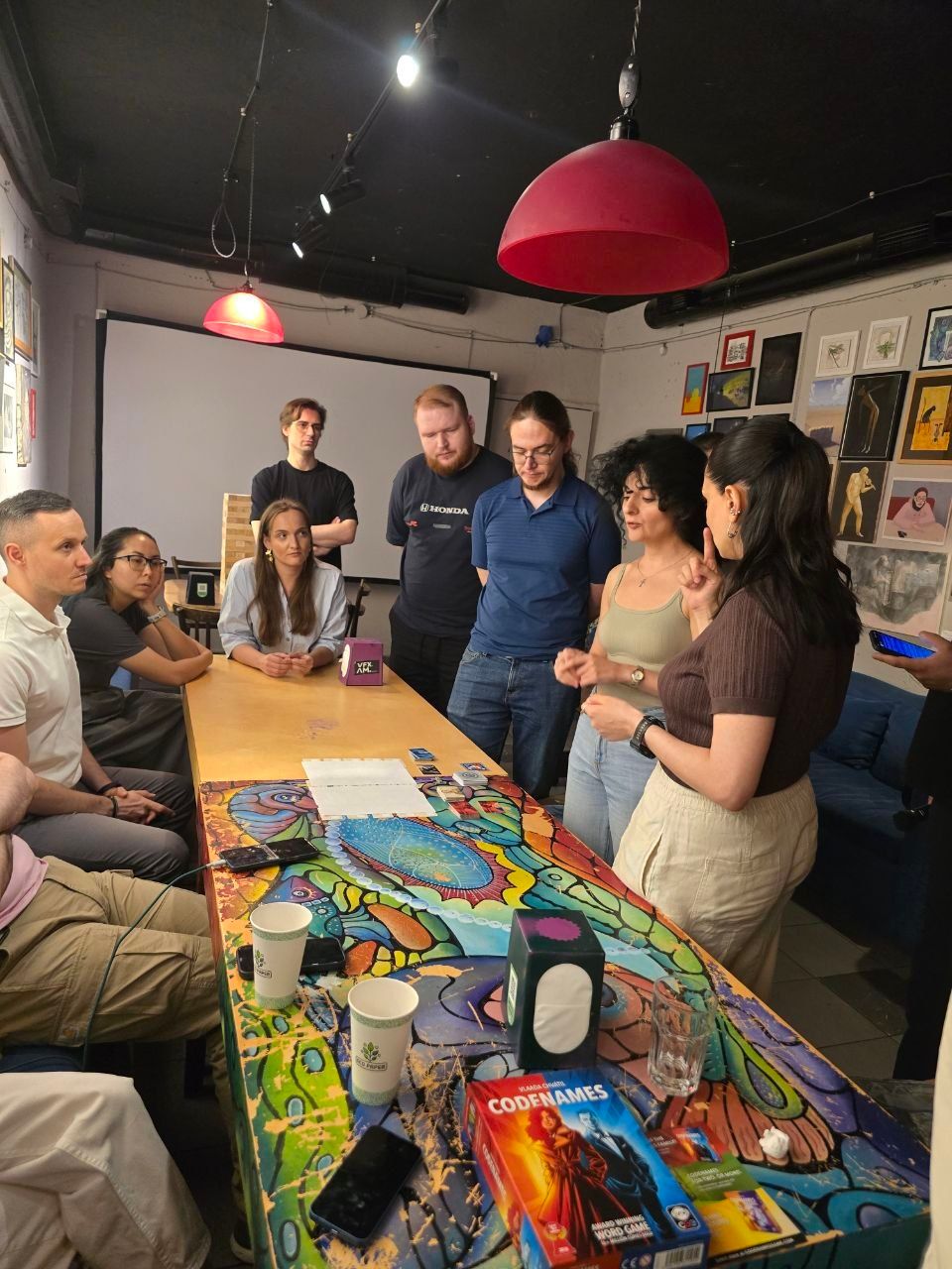 Tabby: guests around the board-game table