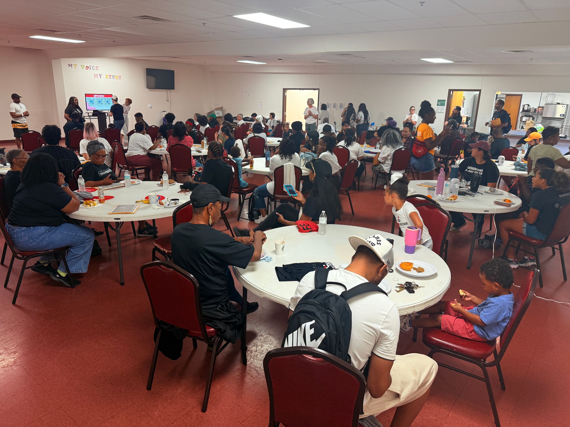 A full room of participants waiting for canvassing training