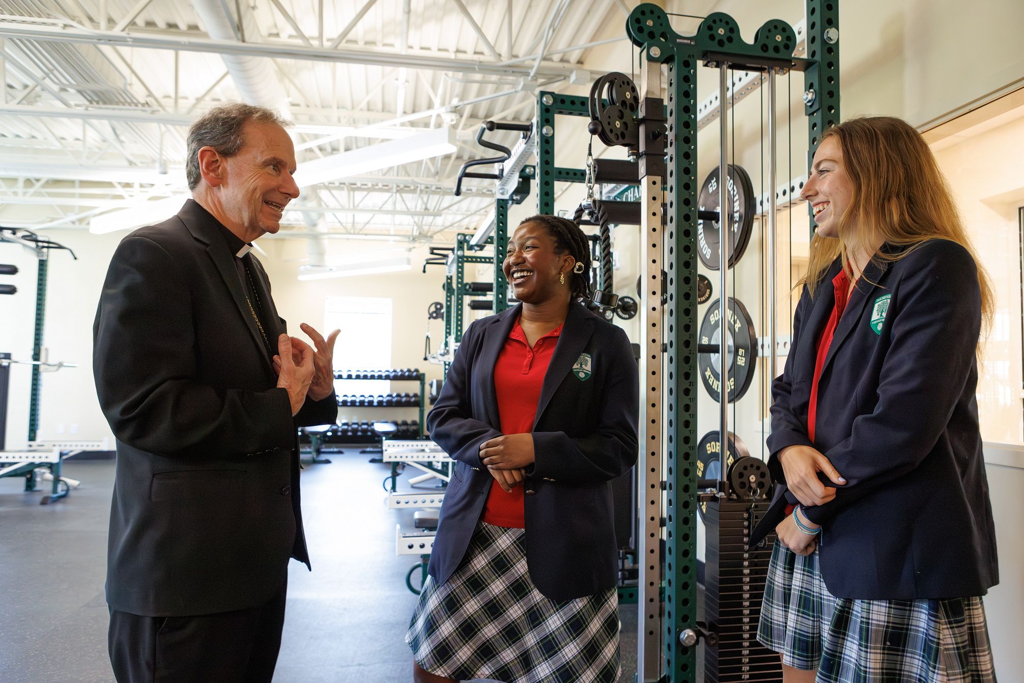 Seniors lead the bishop on a tour of the campus.