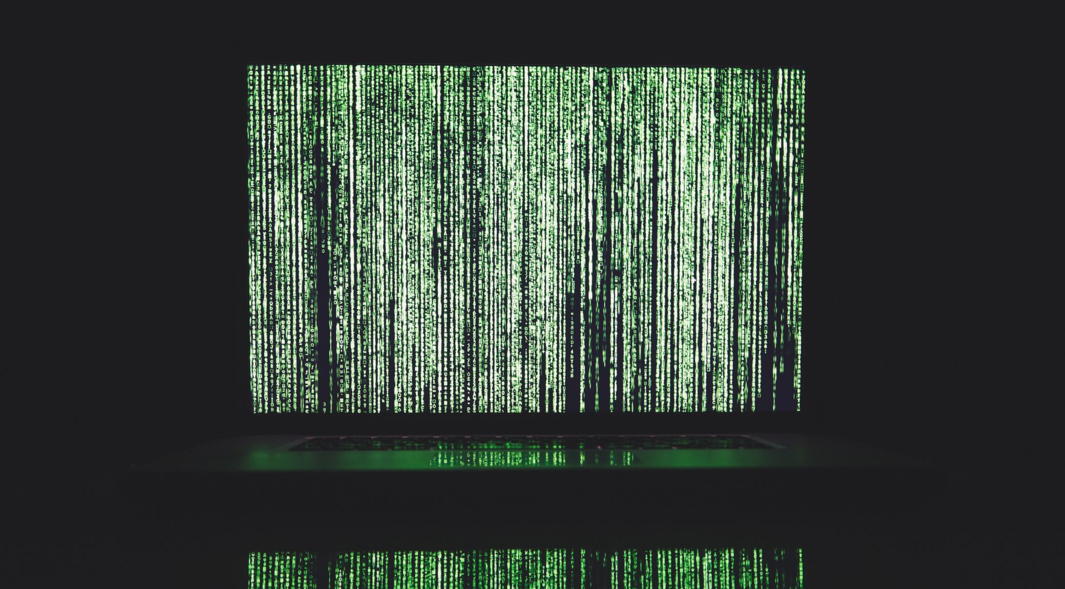 projected screen of green binary codes in waterfall cascading formation